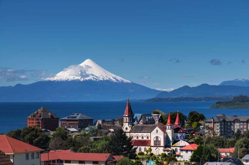 The city of Puerto Varas in Chile with massive volcano in background