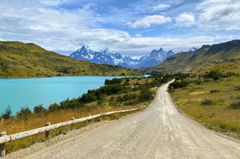 Driving in Chile through beautiful natural sceneries on dirt road next to turquioise river, photo by Next Level of Travel