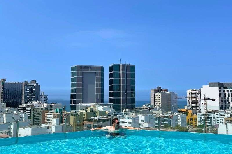 Traveler in a hotel pool in Lima, Peru, photo by Next Level of Travel