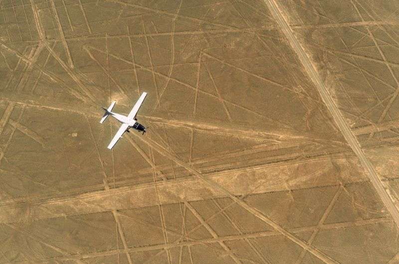 Plane flying above the Nazca Lines in Peru