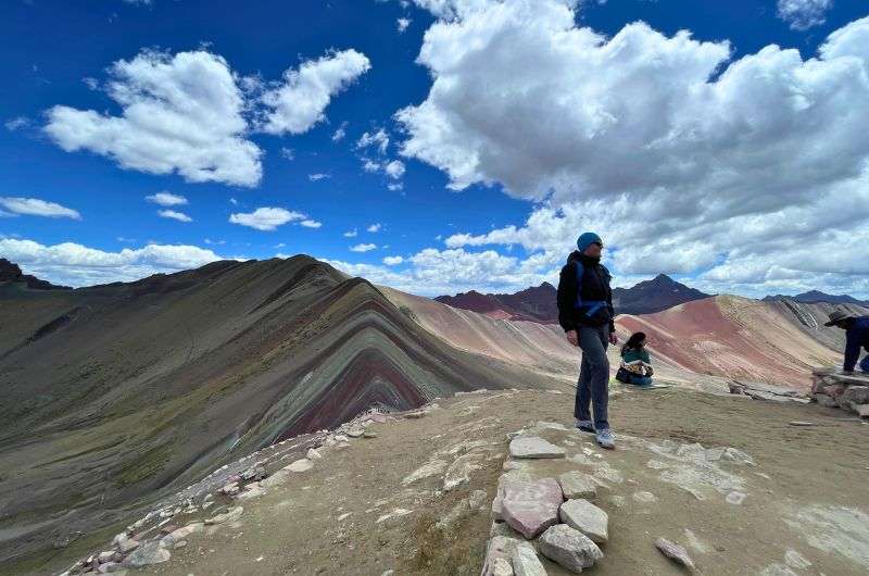 Traveler on Rainbow Mountain in Peru, photo by Next Level of Travel