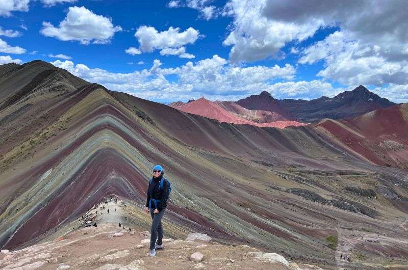 Traveler wearing Christmas traditional colours in Peru, photo by Next Level of Travel