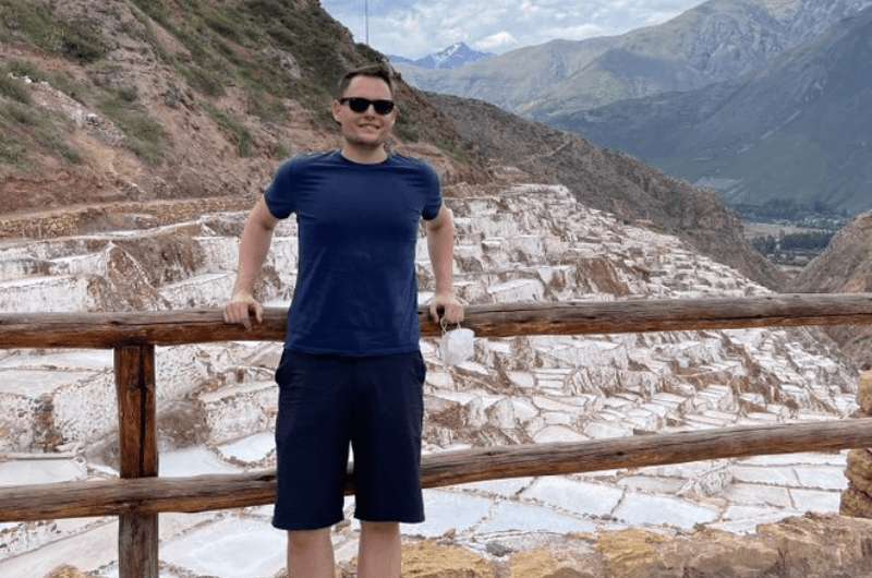 Traveler and the Maras salt pools in Peru, photo by Next Level of Travel