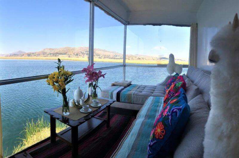 A hotel room at the Qhapaq Lago Titicaca with views out to the lake 