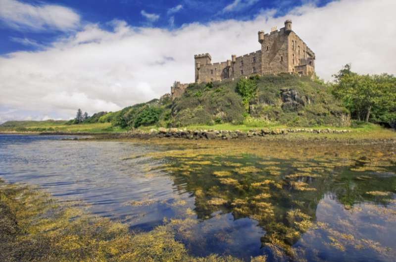 Dunvegan Castle surrounded by water, Scotland castles 