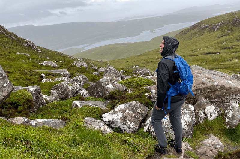 A tourist on Stac Pollaidh, Scottish Highland hikes