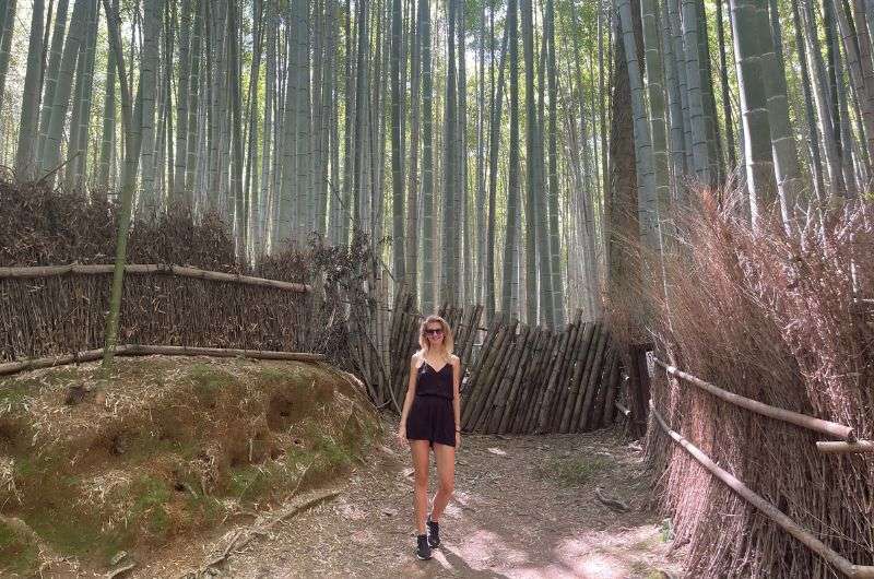 A tourist at Arashiyama Bamboo Forest near Kyoto, Japan