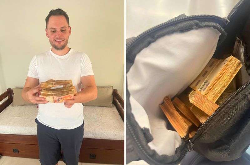 Holding stack of banknotes in Argentina by Next Level of Travel
