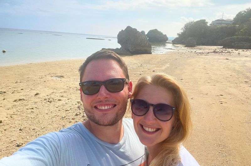 Couple in Okinawa beach, photo by Next Level of Travel