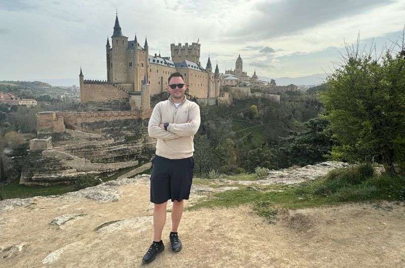 A tourist visiting Alcázar castle in Segovia, itinerary, photo by Next Level of Travel