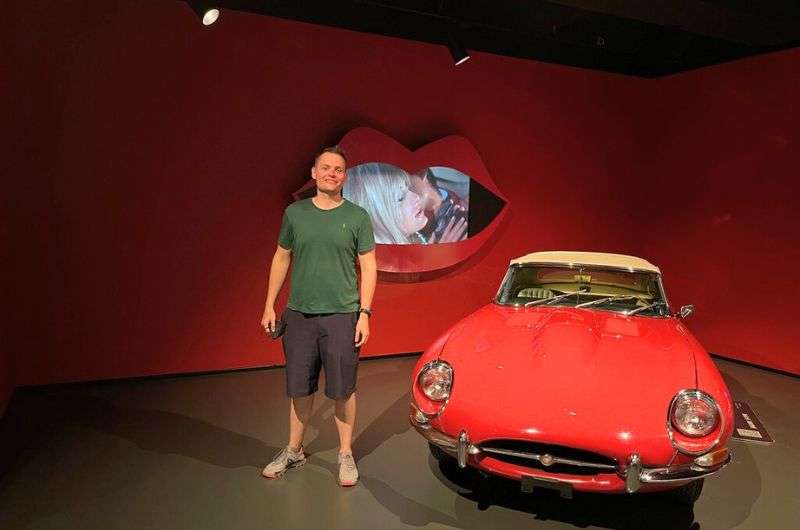 A tourist at the Museo Nazionale dell'Automobile in Turin, Italy, photo by Next Level of Travel