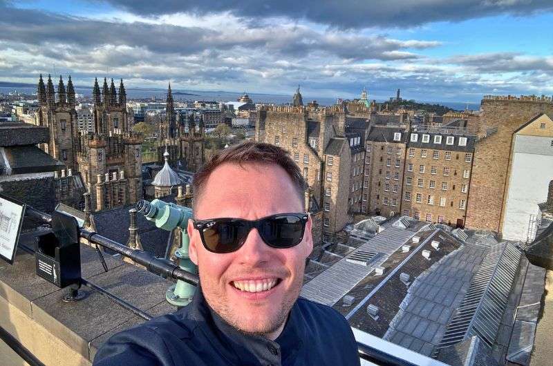 A traveller in exploring Edinburgh in Scotland, photo by Next Level of Travel