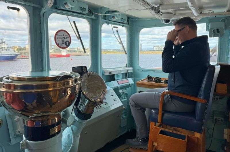 A traveler in the captain's cabin of the Royal Yacht Britannia, Edinburgh 1 day itinerary, photo by Next Level of Travel