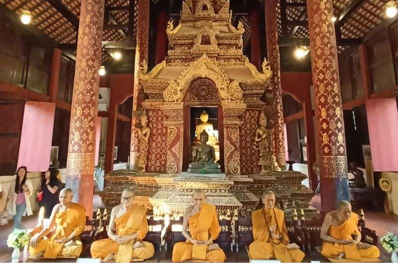 Monks in Wat Phra Singh in Thailand, photo by Next Level of Travel