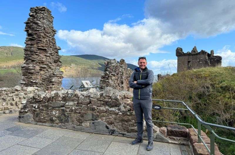 A tourist at Urquhart Castle in Loch Ness, one of the best things to do in loch ness, photo by Next Level of Travel