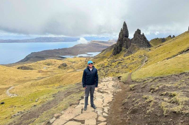 A tourist on the walking trail of Old Man of Storr in Scotland, photo by Next Level of Travel