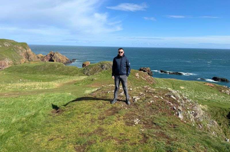 A tourist visiting St Abb’s Head near Edinburgh, photo by Next Level of Travel