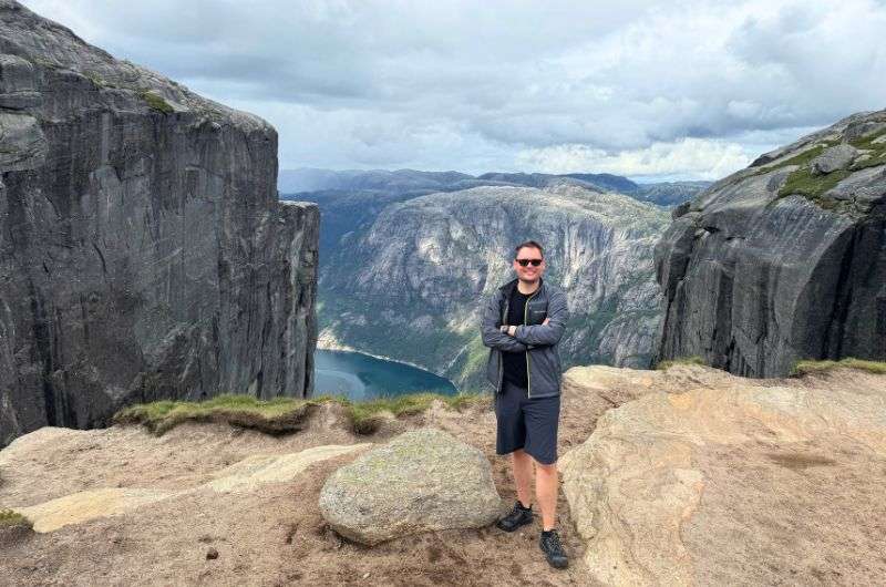 a tourist on Kjerag hike in Norway, photo by Next Level of Travel