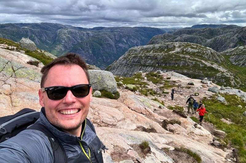 Tourists climbing the Kjerag hike in Norway, photo by Next Level of Travel