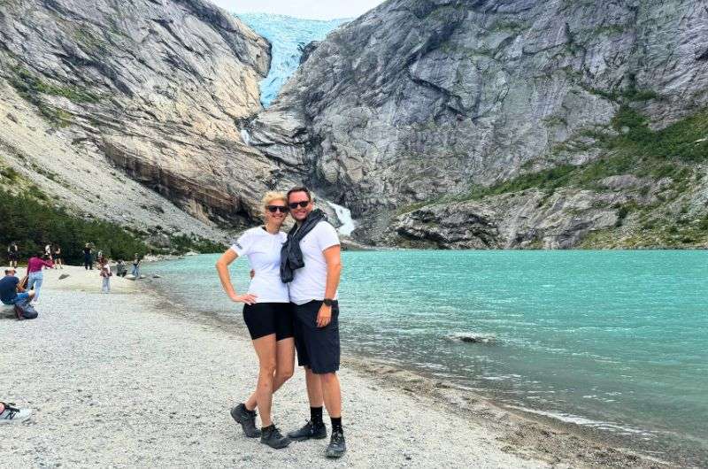 A couple hiking the Briksdal glacier in Norway, photo by Next Level of Travel