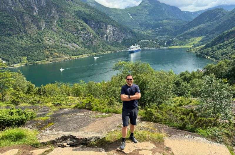 Traveler visiting Geiranger fjord in Norway, photo by Next Level of Travel