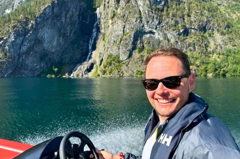 Tourist on a motorboat in Flåm, Norway, photo by Next Level of Travel