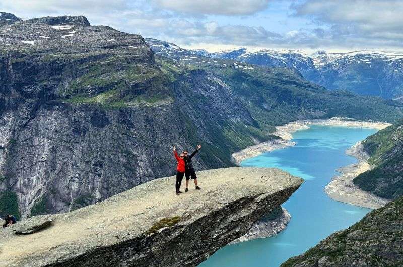 Travelers conquering the Trolltunga in Norway, photo by Next Level of Travel