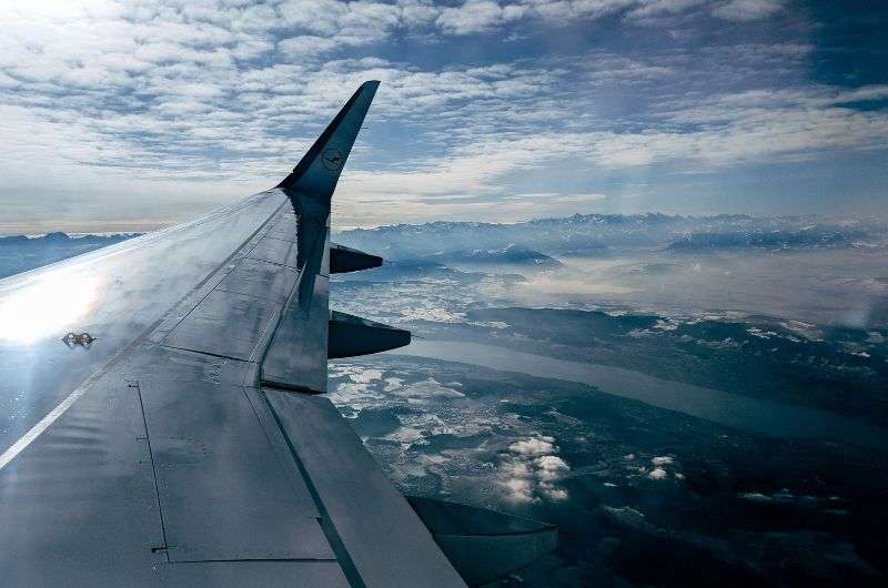 view of an aircraft wing in the clouds