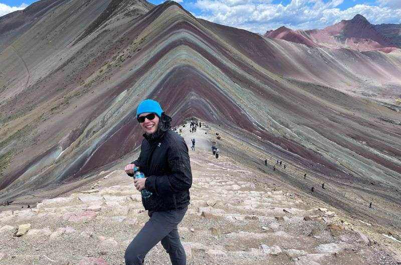 traveler on Vinicunca Rainbow Mountain, Peru, photo by Next level of travel