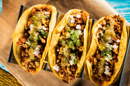 You can put pretty much anything in tacos, but most commonly, the filling consists of carne de rez (a beefsteak)